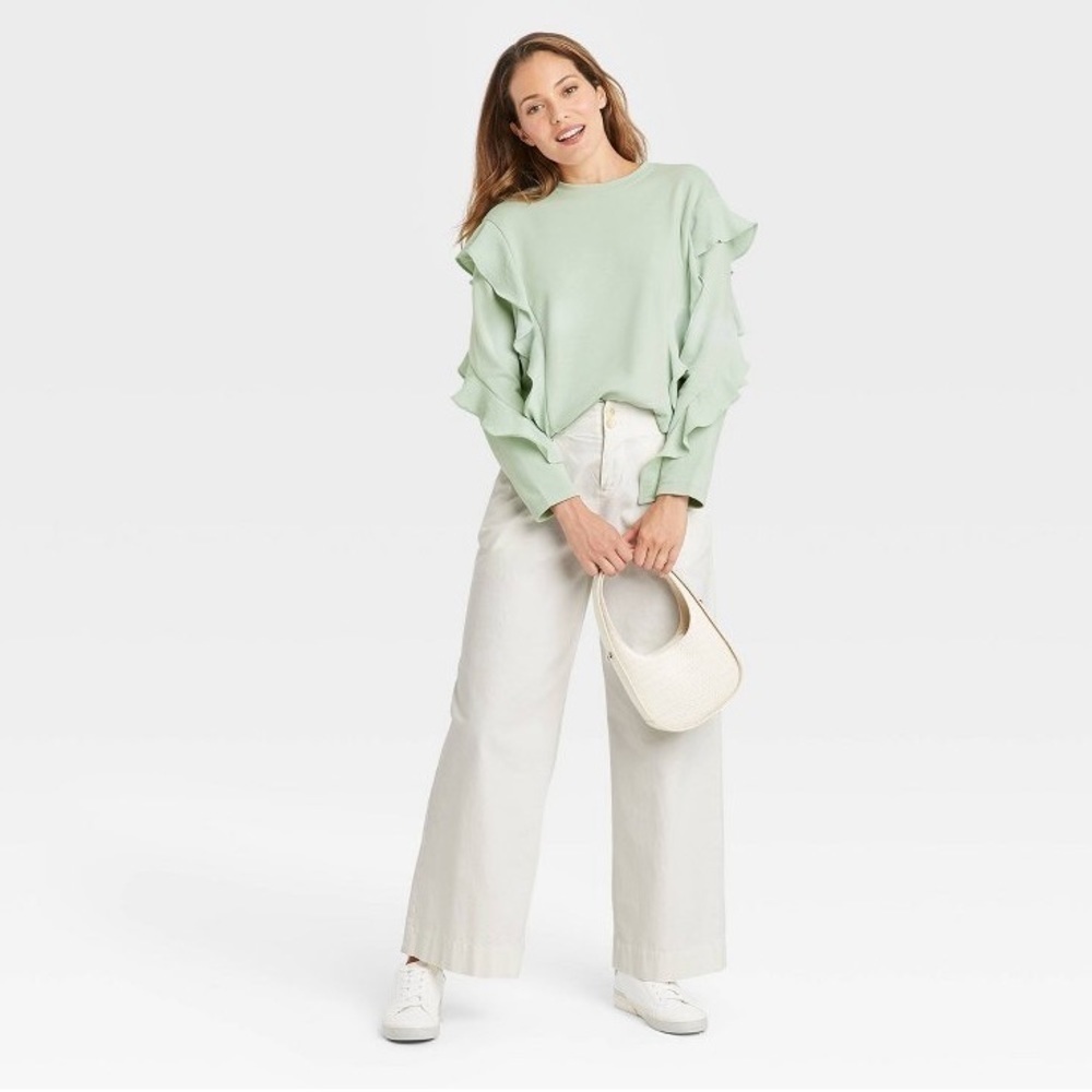 A new day light green ruffle sweatshirt